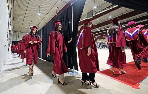 Students with Assiniboine Community College walk into the Manitoba Room at the Keystone Centre at the start of their graduation ceremony on Friday afternoon. (Matt Goerzen/The Brandon Sun)