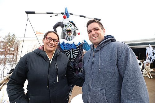 Carla and Mike Mitchell pose with a fiend of theirs outside their home at 29 Cedar Bay in Brandon. The couple, who call their haunted house event Cedar Hollow Scare Away Hunger, are asking visitors to bring a food bank donation if they are able. All donations the Mitchells collect will go to Samaritan House Ministries in Brandon. (Matt Goerzen/The Brandon Sun)