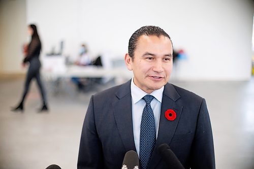 MIKE DEAL / WINNIPEG FREE PRESS
Premier Wab Kinew speaks to the media after he received his COVID-19 and flu vaccines by Adrian Gulowaty, pharmacist owner at the Shoppers Drug Mart, 43 Osborne Street.
231030 - Monday, October 30, 2023.