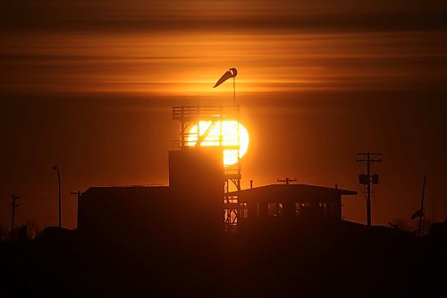 The sun rises behind the original burn structure for the Manitoba Emergency Services College at the Brandon Municipal Airport on a cold Tuesday morning. (Matt Goerzen/The Brandon Sun)