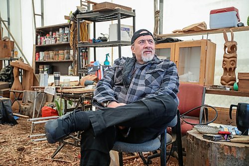 Robert Sanderson in &#x201c;The Shack,&#x201d; a tent setup for wood carving in Victoria, BC, Wednesday, April 19, 2023. Sanderson spent more than 20 years in jail, however he may have his murder conviction overturned due to being wrongfully convicted. He spends his time immersed in artwork. Carving, painting and making jewelry. (Trevor Hagan / Winnipeg Free Press)