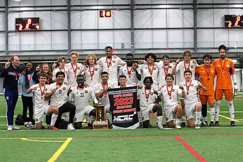 The Brandon University Bobcats celebrate their MCAC men's soccer championship at WSF Soccer North on Tuesday after beating the Providence Pilots on the final. (Thomas Friesen/The Brandon Sun)
