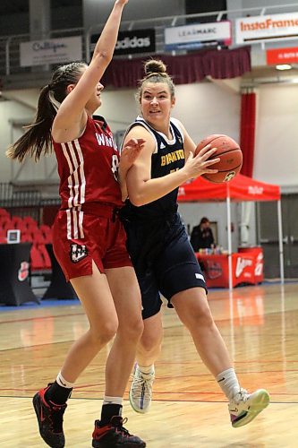 Brandon University Bobcats forward Eden Tabin, right, has recovered enough from her torn ACL at the end of the 2022-23 Canada West women's basketball season to start tonight at the University of Manitoba. (Thomas Friesen/The Brandon Sun)