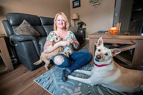 MIKAELA MACKENZIE / WINNIPEG FREE PRESS

Christine Klassen with her dogs, Sam and Archie, on Tuesday, Oct. 31, 2023. After Klassen&#x573; dog Lucy died last winter, she decided to get a tattoo to memorialize her longtime companion. For Eva story.
Winnipeg Free Press 2023.