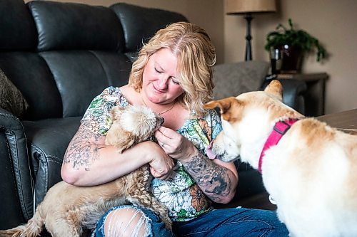 MIKAELA MACKENZIE / WINNIPEG FREE PRESS

Christine Klassen with her dogs, Sam and Archie, on Tuesday, Oct. 31, 2023. After Klassen&#x573; dog Lucy died last winter, she decided to get a tattoo to memorialize her longtime companion. For Eva story.
Winnipeg Free Press 2023.
