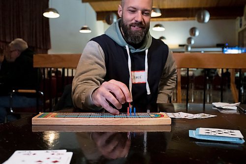 BROOK JONES / WINNIPEG FREE PRESS
Winnipegger Lyndon Demers hosts Lyndon's Cribbage Nights every second Wednesday from 6:30 to 9 p.m. on the second floor of Heather Curling Club at 120 Youville Street. As many as 20 enthusiatic cribbage players gather for the cribbage nights, rotating opponents as the evening goes along. Pictured: St. Laurent resident Jamie Goodfellow moving a peg on a crib board, while playing cribbage at the Heather Curling Club in Winnipeg, Man., Wednesday, Oct. 25, 2023.