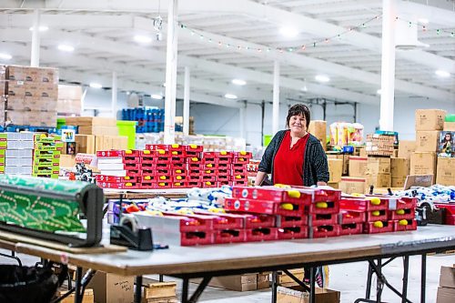 MIKAELA MACKENZIE / WINNIPEG FREE PRESS

Shawna Bell, executive director, at the Christmas Cheer Board headquarters on Thursday, Nov. 2, 2023. They are opening the phone lines tomorrow (the earliest they ever have) in anticipation of a greater need for hampers this year. For Kevin story.
Winnipeg Free Press 2023.