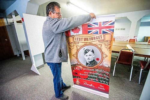 MIKAELA MACKENZIE / WINNIPEG FREE PRESS

Brian McElroy opens up a Morden street banner commemorating one of his relatives in Darlingford, Manitoba on Monday, Oct. 30, 2023. For Jen story.
Winnipeg Free Press 2023.