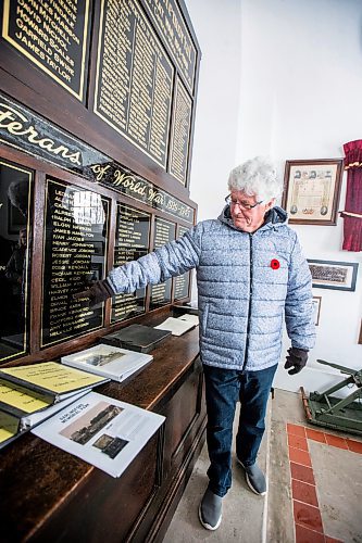 MIKAELA MACKENZIE / WINNIPEG FREE PRESS

Harvey Kinsman points out his relatives&#x560;names in the war memorial building in Darlingford, Manitoba on Monday, Oct. 30, 2023. For Jen story.
Winnipeg Free Press 2023.