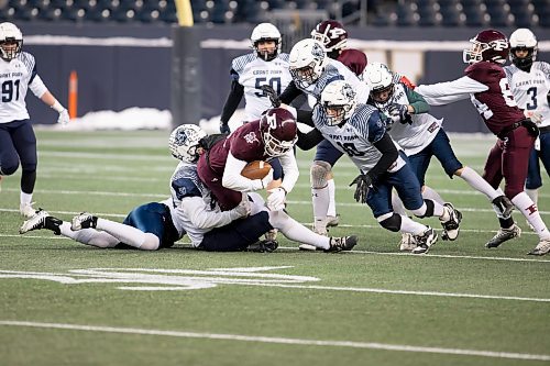 BROOK JONES / WINNIPEG FREE PRESS
The Grant Park High School Pirates claimed a 24-21 victory over the St. Paul's High School Crusaders in the Winnipeg High School Football League AAAA Conference (top bracket) semi-final of the ANAVETS Bowl at IG Field in Winnipeg, Man., Friday, Nov. 3,. 2023. Pictured: Grant Park Pirates linebacker Max Payne tackles St. Paul's Crusaders quarterback Cole Anseeuw during second quarter action.