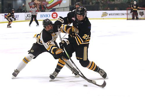 Brandon Wheat Kings forward Cole Dupuis (27) tries to get a shot off as Winnipeg Bruins defenceman Brock Assailly (12) runs interference during Manitoba U18 AAA Hockey League action at J&amp;G Homes Arena on Saturday evening. Brandon won 5-3. (Perry Bergson/The Brandon Sun)
Nov. 4, 2023