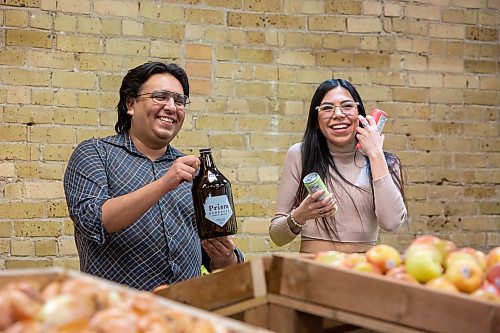 BROOK JONES / WINNIPEG FREE PRESS
The Ashdown Market, a grocery store that opened in the Exchange District in May 2023, is becoming bigger through a new partnership with Federate Cooperative Limited. Pictured: Ashdown Market co-owners Josh Giesbrecht (left), 32, and Marley Mecas, 25, are all smiles as they promote Prism Kombucha sparkling fermented tea drinks at 171 Bannatyne Ave., in Winnipeg, Man., Tuesday, Nov. 7, 2023.