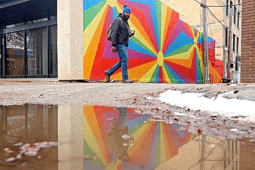 08112023
A pedestrian is reflected in a puddle while walking along Rosser Avenue on a grey Wednesday.  (Tim Smith/The Brandon Sun)