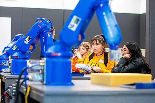 MIKAELA MACKENZIE / WINNIPEG FREE PRESS

Diamond Desmarais, grade 11 Tech Voc student, learns how to control an industrial robot arm in the robotics lab at the Jill of All Trades event (which encourages girls to enter the trades) on Wednesday, Nov. 8, 2023. For Maggie story.
Winnipeg Free Press 2023.