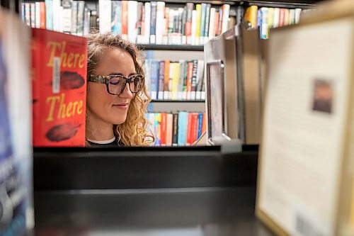 BROOK JONES / WINNIPEG FREE PRESS
St. James-Assinniboia Public Library branch head librarian Stephanie George is pictured looking at books in the non-fiction book section at the local library in Winnipeg, Man., Tuesday, Nov. 7, 2023.