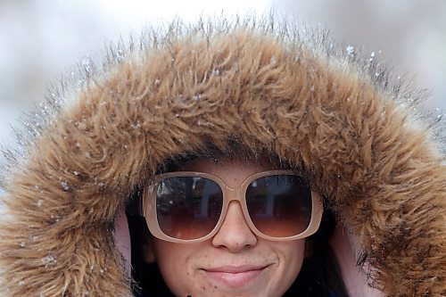 09112023
Sydney Adams sports big sunglasses and a big fur hood while walking along Rosser Avenue in downtown Brandon during light flurries on Thursday.
(Tim Smith/The Brandon Sun)