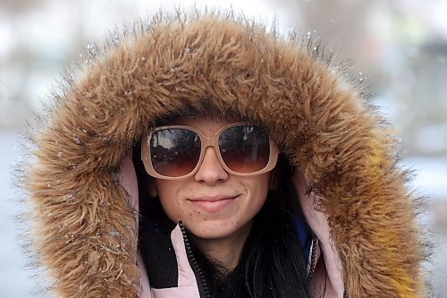 09112023
Sydney Adams sports big sunglasses and a big fur hood while walking along Rosser Avenue in downtown Brandon during light flurries on Thursday.
(Tim Smith/The Brandon Sun)