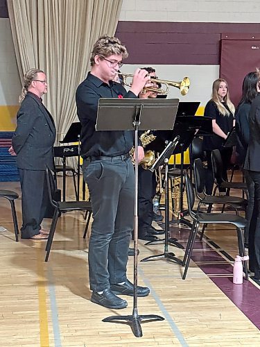 Grade 11 student Noah Fulford plays The Last Post and Reveille on his trumpet during the Crocus Plains Regional Secondary School Remembrance Day ceremony Friday. (Kyla Henderson/The Brandon Sun)