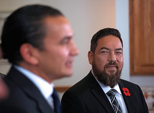 Former Brandon School Division trustee Jason Gobeil watches Manitoba Premier Wab Kinew speak at the Brandon Chamber of Commerce on Friday morning, announcing the establishment of a new Westman regional cabinet office that will act as a liaison between families, businesses and community organizations in the region, and the Manitoba government. (Matt Goerzen/The Brandon Sun)