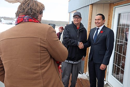 10112023
Manitoba Premier Wab Kinew (R) has a photo taken with Gambler First Nation resident Mark Ducharme during a visit to the community near Russell on Friday. Premier Kinew was on hand as Gambler First Nation announced a $1 Million donation to the John James Tanner Legacy Foundation, which aims to offer a variety of supports to children and families affected by the loss of a family member in relation to Missing and Murdered Indigenous Women, Girls, Men, Boys, and 2SLGBTQQIA+ cases.
(Tim Smith/The Brandon Sun) 