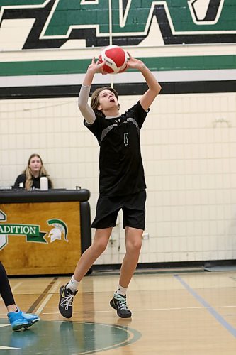 Maden Simard sets a ball during the Neelin Spartans junior varsity boys AAA volleyball provincial qualifier at Neelin on Saturday. The Spartans beat the Neepawa Tigers in straight sets in the final and are off to provincials in Winnipeg on Nov. 23-25. (Thomas Friesen/The Brandon Sun)