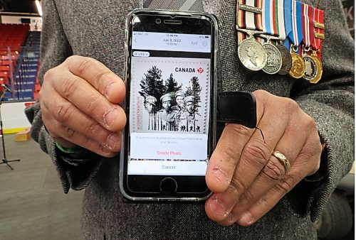 John Gero holds up a digital image depicting a Canadian stamp issued in 2016 to mark the 100th anniversary of the formation of the No. 2 Construction Battalion in Nova Scotia for Black History Month. Gero and his two brothers Walter Gero and Peter Gero are the grand newphews to Joseph and William Paris, two brothers who were part of that original predominantly black battalion. Since learning of their grand uncles' heritage earlier this year, John, Walter and Peter laid a wreath at the cenotaph during Brandon's Remembrance Day ceremony at the Keystone Centre on Saturday. (Matt Goerzen/The Brandon Sun)