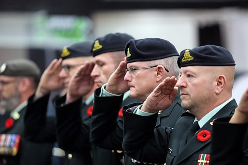 From right: Maj. Scott Youngson and Master Warrant Officer Ken Hood, both with CFB Shilo, stand beside Lt. Col. Joe O'Donnel, CO of the First Regiment Canadian Horse Artillery, and Chief Warrant Officer Sean McGowan, the Regimental Sargeant Major of 1RCHA, during Brandon's Remembrance Day ceremony at the Keystone Centre on Saturday morning. (Matt Goerzen/The Brandon Sun).