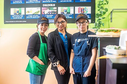 MIKAELA MACKENZIE / WINNIPEG FREE PRESS

Owner Kim Le (centre) with employees Jenny Tran (left) and Ngoc Le at Winnipeg's Khanh Hoa, which made the cut for best sandwich in the world on a Guardian List, on Monday, Nov. 13, 2023. For Erik story.
Winnipeg Free Press 2023.
