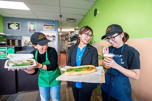 MIKAELA MACKENZIE / WINNIPEG FREE PRESS

Owner Kim Le (centre) with employees Jenny Tran (left) and Ngoc Le at Winnipeg&#x573; Khnh Ha, which made the cut for &#x482;est sandwich in the world&#x4e0;on a Guardian List, on Monday, Nov. 13, 2023. For Erik story.
Winnipeg Free Press 2023.