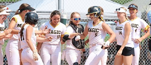 Jessie Henry (5) of the under-17 AAA Westman Magic is greeted by her teammates at the plate after hitting a home run during the final of the International Classic&#x2019;s gold medal game at the Ashley Neufeld Softball Complex in Brandon in June. Westman won 7-4. (Perry Bergson/The Brandon Sun)