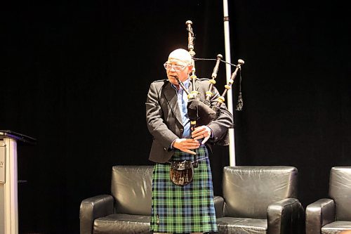 Brandon University president David Docherty plays an excerpt from the title track of &quot;Jesus Christ Superstar&quot; on the bagpipes at the John Howard Society of Brandon's Crossing the Line fundraiser for a new transitional housing facility on Thursday evening. One of the items attendees bidded on during an auction was the chance to get a bagpipe serenade from Docherty. (Colin Slark/The Brandon Sun)