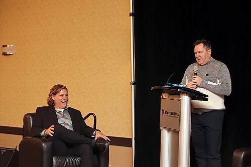 Mayor Jeff Fawcett (left) winces after being on the receiving end of a cutting remark by Kerry Auriat (right). The mayor was thoroughly roasted at the John Howard Society of Brandon's Crossing the Line fundraiser for a new transitional housing facility at the Victoria Inn on Thursday evening. (Colin Slark/The Brandon Sun)