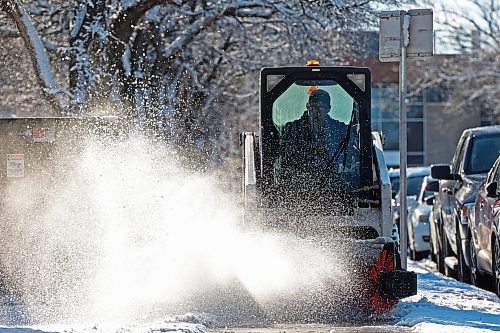 16112023
A worker clears fresh snow from the sidewalk bordering 20th Street at Brandon University after overnight flurries Thursday.
(Tim Smith/The Brandon Sun)