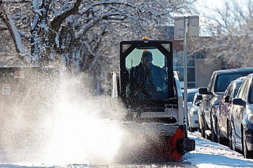 16112023
A worker clears fresh snow from the sidewalk bordering 20th Street at Brandon University after overnight flurries Thursday.
(Tim Smith/The Brandon Sun)