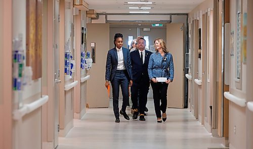 MIKE DEAL / WINNIPEG FREE PRESS
(From left) Health, Seniors and Long-Term Care Minister Uzoma Asagwara, Logan Oxenham, MLA for Kirkfield Park, and Rachel Ferguson, Chief Operating Officer at the Grace Hospital, walk along a hospital corridor before the announcement Friday morning.
Health, Seniors and Long-Term Care Minister Uzoma Asagwara announces, during a media call at the Grace Hospital Friday morning, that the Manitoba government will be taking steps to conclude the work of the Diagnostic and Surgical Recovery Task Force (DSRTF), and redirecting focus and funding back to public health-care delivery with priority investments in public surgeries and diagnostics.
See Carol Sanders story
231117 - Friday, November 17, 2023.