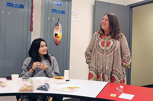 17112023
Student Raylene Constant visits with Principal Katherine MacFarlane while beading during a lunch provided by Prairie Hope High School for students and their families in conjunction with an open house at the school in Brandon on Friday. The high school provides lunches for students five days a week.
(Tim Smith/The Brandon Sun) 