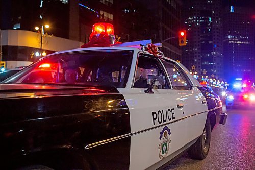 BROOK JONES / WINNIPEG FREE PRESS
The Winnipeg Police Museum participating in the Manitoba Hydro Santa Claus Parade in Winnipeg, Man., Saturday, Nov. 18, 2023. The Santa Claus parade has run annually in Winnipeg since the former Eaton&#x2019;s department store organized the first one in 1909.