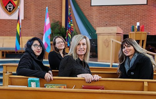 Gemma Webster, Aly Wowchuk, Wendy Friesen and Anastasia Jane Gibson, all supporters of Brandon Pride, share a moment after the International Transgender Day of Remembrance service at Knox United Church on Monday. (Michele McDougall/The Brandon Sun)