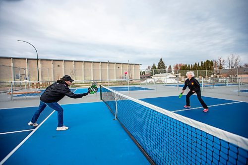 MIKAELA MACKENZIE / WINNIPEG FREE PRESS

Muyrna Kereluk (left) and Cecile LeBlanc play pickleball at Jill Officer Park in North Kildonan on Monday, Nov. 20, 2023.  LeBlanc plays five days a week indoors in the winter, but is also savouring the unexpected extended outdoor season with the current warmer weather. She says that there need to be more easily accessible public pickleball courts (both indoor and outdoor), as the sport is a key way that many seniors stay active these days. Standup.
Winnipeg Free Press 2023.