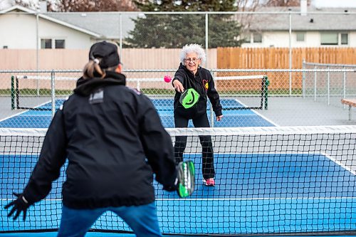 MIKAELA MACKENZIE / WINNIPEG FREE PRESS

Cecile LeBlanc (centre) plays pickleball with her friend Muyrna Kereluk at Jill Officer Park in North Kildonan on Monday, Nov. 20, 2023.  LeBlanc plays five days a week indoors in the winter, but is also savouring the unexpected extended outdoor season with the current warmer weather. She says that there need to be more easily accessible public pickleball courts (both indoor and outdoor), as the sport is a key way that many seniors stay active these days. Standup.
Winnipeg Free Press 2023.