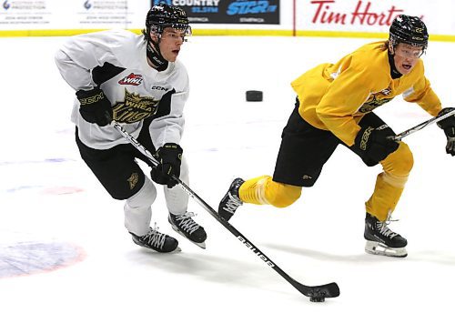 Brandon Wheat Kings forward Brett Hyland, shown in white skating beside forward Evan Groening during a drill at practice on Monday, is hoping his club can win the first game of his Western Hockey League career in his hometown of Edmonton when they visit the Oil Kings tonight. (Perry Bergson/The Brandon Sun)