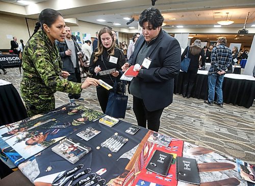 JOHN WOODS / WINNIPEG FREE PRESS
Linda Lobster, Master Corporal, Canadian Forces Recruiting Centre, Diversity Recruiter, talks to Autumn Garnham, University of Manitoba, centre, and Ashley Albert at The Business Council of Manitoba Indigenous Job Fair in the Canid Inn Polo Park Winnipeg Monday, November  20, 2023. 

Reporter: Cash