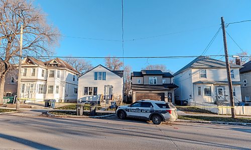 MIKE DEAL / WINNIPEG FREE PRESS
A Winnipeg Police Service car sits outside 447 and 451 Burrows Avenue Tuesday morning. Both houses are taped off.
231121 - Tuesday, November 21, 2023.