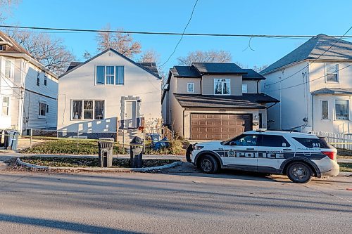 MIKE DEAL / WINNIPEG FREE PRESS
A Winnipeg Police Service car sits outside 447 and 451 Burrows Avenue Tuesday morning. Both houses are taped off.
231121 - Tuesday, November 21, 2023.