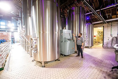 MIKAELA MACKENZIE / WINNIPEG FREE PRESS

Head of brewery operations Rob McWhinney shows the new CiCi Carbon Recapture System in their fermentation vat area at the Little Brown Jug brewery on Tuesday, Nov. 21, 2023. 
Winnipeg Free Press 2023.