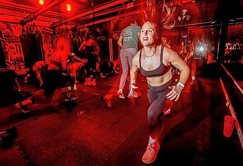 JOHN WOODS / WINNIPEG FREE PRESS
Amie Seier, owner of The Community Gym, participates in an evening fitness class at her Main St gym in Winnipeg Tuesday, November  21, 2023. The gym has reopened after it&#x2019;s ceiling collapsed.

Reporter: gabby