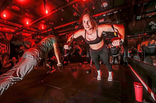 JOHN WOODS / WINNIPEG FREE PRESS
Amie Seier, owner of The Community Gym, participates in an evening fitness class at her Main St gym in Winnipeg Tuesday, November  21, 2023. The gym has reopened after it&#x2019;s ceiling collapsed.

Reporter: gabby