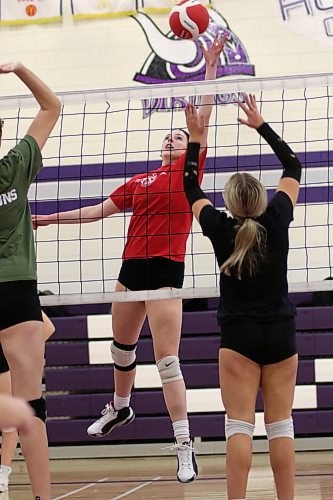 Ava Hertzog tips over a block during Vincent Massey Vikings varsity girls volleyball practice with the Neelin Spartans on Wednesday. The Vikings are off to the AAAA provincial quarterfinals on Saturday. (Thomas Friesen/The Brandon Sun)