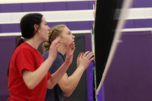 Ava Hertzog, left, and Jersey Hansen-Young prepare to block during Vincent Massey Vikings varsity girls volleyball practice on Wednesday. The Vikings are off to the AAAA provincial quarterfinals on Saturday. (Thomas Friesen/The Brandon Sun)