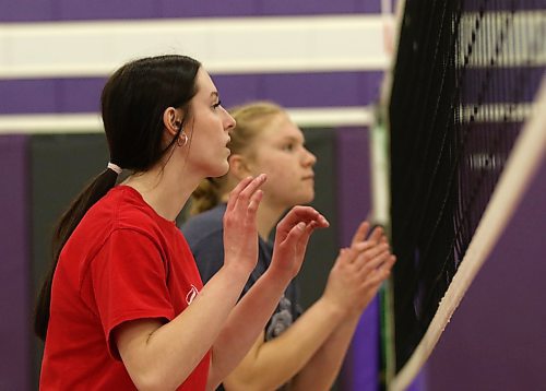Ava Hertzog, left, and Jersey Hansen-Young prepare to block during Vincent Massey Vikings varsity girls volleyball practice on Wednesday. The Vikings are off to the AAAA provincial quarterfinals on Saturday. (Thomas Friesen/The Brandon Sun)